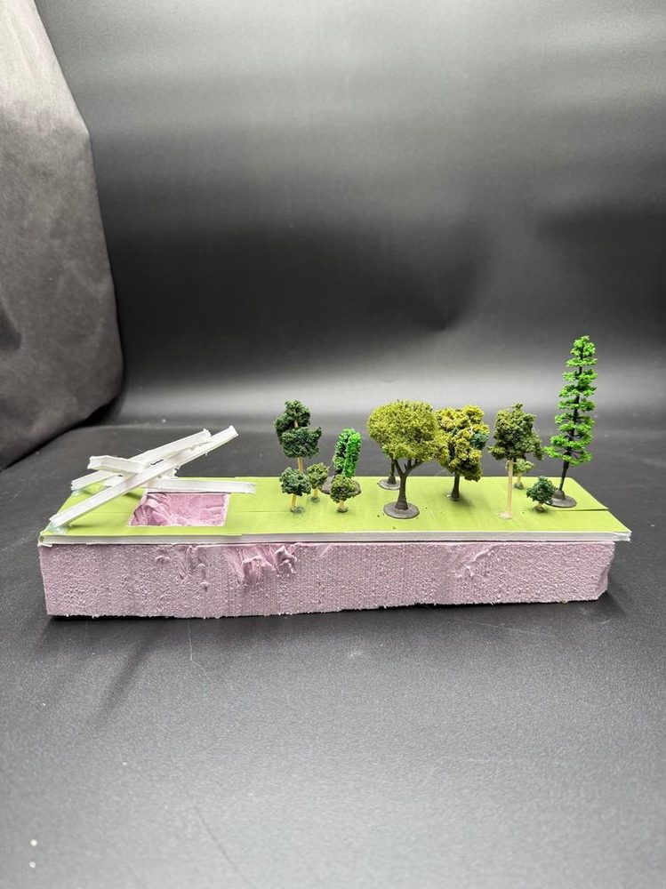 Model — the grass roof carried on a timber frame