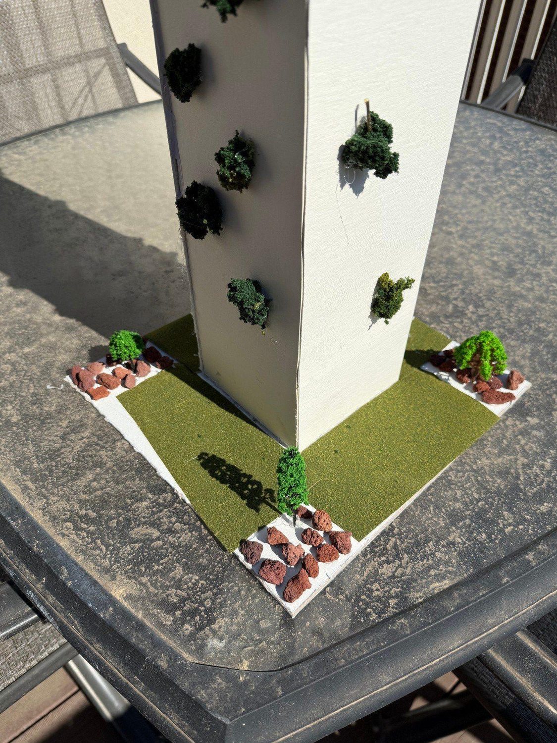 From above — planting pockets across the façade and the base plate